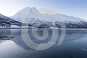 Panorama of snowy fjords and mountain range, Senja, Norway Amazing Norway nature seascape popular tourist attraction.