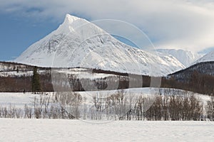 Panorama of snowy fjords and mountain range, Senja, Norway Amazing Norway nature seascape popular tourist attraction.