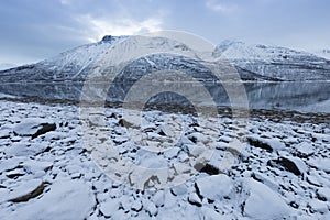 Panorama of snowy fjords and mountain range, Senja, Norway Amazing Norway nature seascape popular tourist attraction.