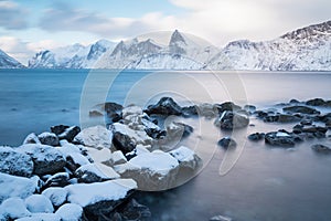 Panorama of snowy fjords and mountain range, Senja, Norway Amazing Norway nature seascape popular tourist attraction.