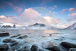 Panorama of snowy fjords and mountain range, Senja, Norway Amazing Norway nature seascape popular tourist attraction.