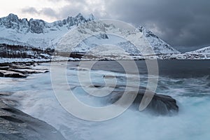 Panorama of snowy fjords and mountain range, Senja, Norway Amazing Norway nature seascape popular tourist attraction.