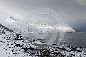 Panorama of snowy fjords and mountain range, Senja, Norway Amazing Norway nature seascape popular tourist attraction.