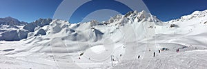 Panorama of snowy mountain peaks and ski slopes at Tignes, ski resort in the Alps France