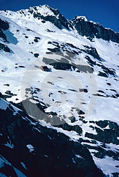 Panorama of snowy mountains and high alpine peaks in wintery Bernese Oberland in Switzerland