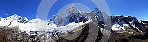 Panorama of snowy mountains and valley in the Cordillera Blanca Mountain range along the popular Santa Cruz Trek near Huaraz in Pe