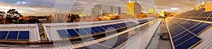 Panorama of solar panels on rooftop