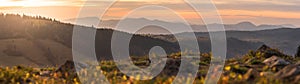 Panorama Sowie Mountains, orange sunset over the mountain valley shrouded in fog