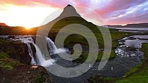 Panorama Spring in western Iceland Kirkyufetl mountain waterfall cascades at sunset