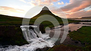 Panorama Spring in western Iceland Kirkyufetl mountain waterfall cascades at sunset