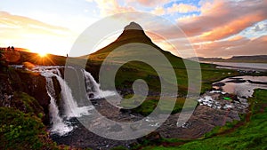 Panorama Spring in western Iceland Kirkyufetl mountain waterfall cascades at sunset