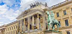 Panorama of a statue of a horseman in front of the castle in Braunschweig