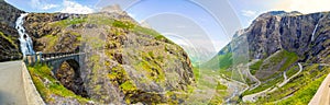 Panorama of Stigfossen waterfall under bridge and Trollstigen road, Norway