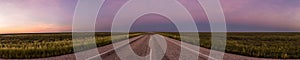 panorama of a straight road through the outback of Australia, after a beautiful sunset, Nothern territory photo