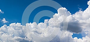 Panorama of summer clouds in the blue sky