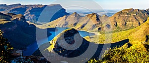 Panorama of the sun settings over the Blyde River Dam and Blyde River Canyon