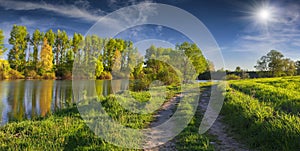 Panorama of the sunny summer morning on river