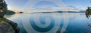 Panorama of the sunrise along the beautiful shorelines of the Gulf Islands off the shores of Vancouver Island