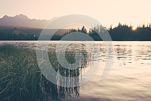 Panorama of sunrise over mountain lake Strbske Pleso