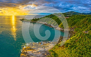 Panorama sunset above Promthep cape is a mountain of rock that extends into the sea in Phuket Thailand.