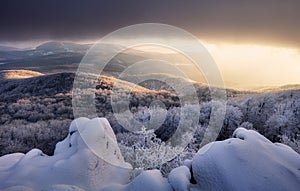 Panorama sunset colored sky winter snow clouds in Slovakia nature landscapes. Mountain sunset sky zoom in peak Vapenna frost