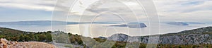 Panorama of sunset evening view over croatias mediterranean cliffs, ocean view photo