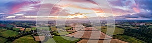 Panorama of Sunset over Berry Pomeroy Meadows and Fields from a drone, Devon, England photo