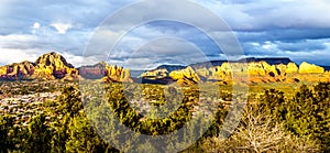 Panorama of a Sunset over Thunder Mountain and other red rock mountains surrounding the town of Sedona, Arizona