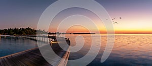 Panorama of a sunset over a tropical island in the Maldives