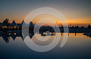 Panorama sunset water reflection view.