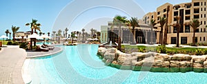 The panorama of swimming pool at the luxury hotel