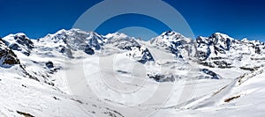 Panorama of Swiss Alp mountains ridge of Diavolezza with sumit group