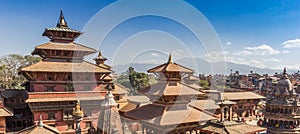 Panorama of temples on Durbar square with mountain background in Patan