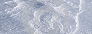 Panorama Texture of Patterns on snow waves in bright sunlight. With a natural surface. Copyspace template background