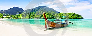 Panorama of thai traditional wooden longtail boat and beautiful sand beach