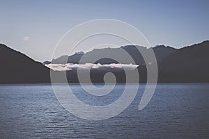 Panorama of Thun lake and away mountains in city Spiez, Switzerland