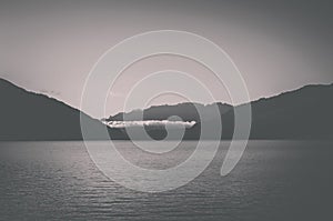 Panorama of Thun lake and away mountains in city Spiez, Switzerland