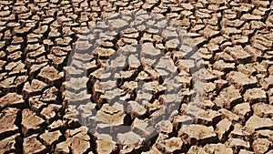 Panorama of tiles of dried under the sun during a drought land.