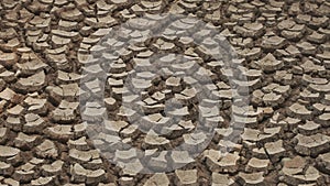 Panorama of tiles of dried under the sun during a drought land.