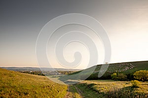 Panorama of Titelski breg, or titel hill, in Vojvodina, Serbia, with a dirtpath countryside road, in an agricultural landscape ay