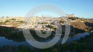 Panorama of Toledo in Spain at sunrise, time-lapse, moving light and shadow. Toledo Cathedral, AlcÃ¡zar of Toledo, Tagus River