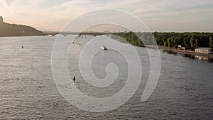 panorama Top Aerial view moving fishing boat ocean. sailing motor boat with angler on Dnipro river at sunrise sunset