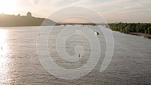 panorama Top Aerial view moving fishing boat ocean. sailing motor boat with angler on Dnipro river at sunrise sunset