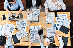 Panorama top view diverse analyst team analyzing financial data. Meticulous