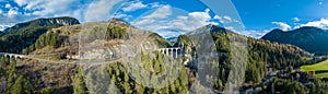 Landwasser Viaduct Glacier and Bernina express railway in switzerland winter photo