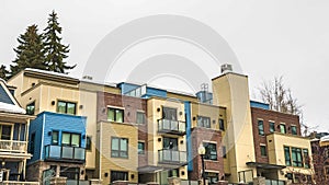 Panorama Townhomes facade with balconies in Park City Utah against cloudy sky in winter