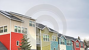 Panorama Townhouses with colorful exterior walls with cloudy sky background in winter