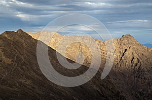 Panorama from trail to Toubkal, ridges and highest peaks of High Atlas mountain in Morocco on sunrise