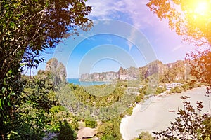 Panorama of the two sides of Railay peninsula, Krabi, Thailand, from a high view point at sunny day. A bit cloudy blue sky and