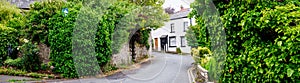 Panorama of a Typical whitewashed country cottage set in open countryside